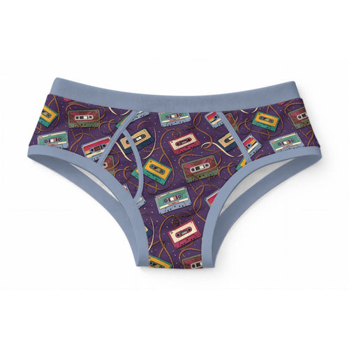 ABDL adult briefs featuring a retro cassette tape pattern with unraveling tape ribbons on purple starry fabric with blue trim