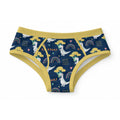 Dark navy blue 100% cotton adult briefs featuring an all-over print of white dinosaurs hugging trees, rainbows, ROAR text, and mustard yellow polka-dotted elastic trim.