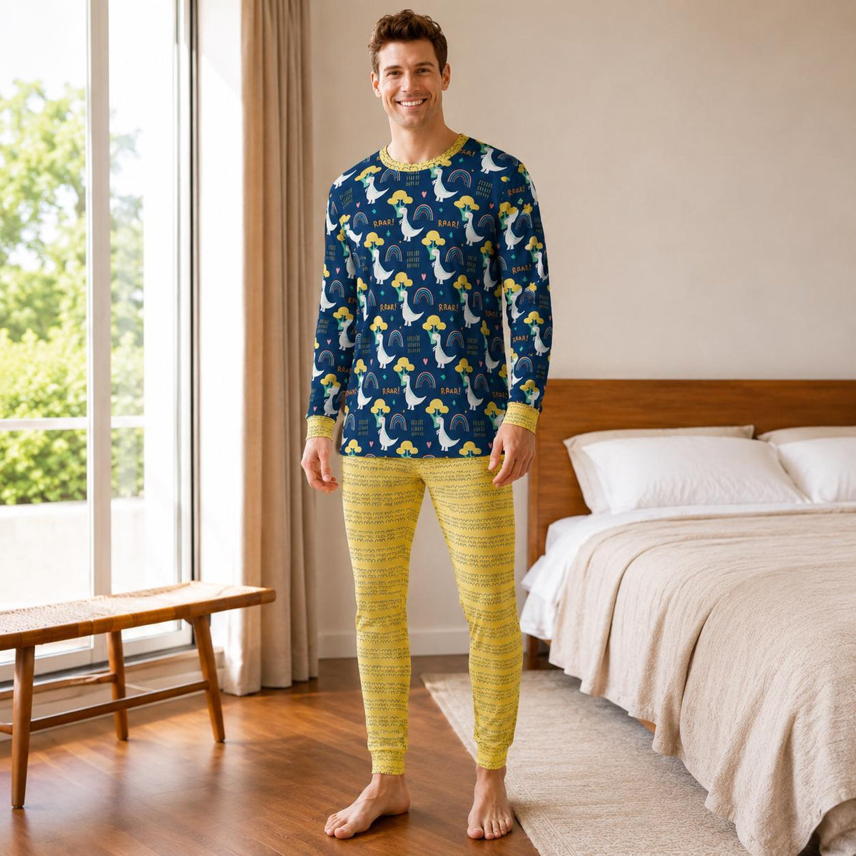 Man wearing two-piece ABDL pajama set with navy blue rainbow dinosaur top and mustard yellow patterned bottoms